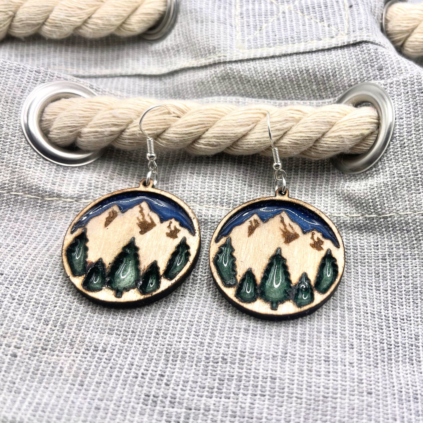 Beautiful mountain dangle earrings with twilight blue sky and enchanted forest green trees are lightweight, comfortable and easy to wear all day.