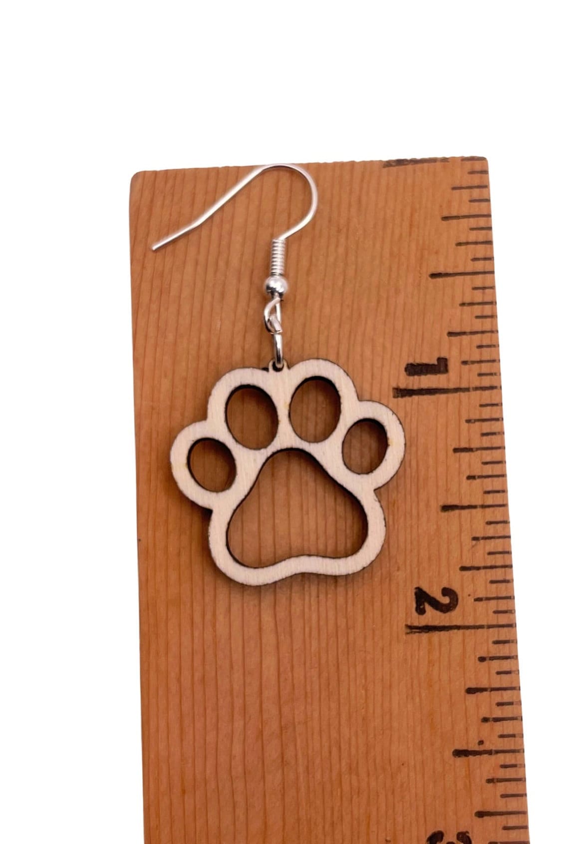 Single paw print dangle earrings, approximately 1.75 inches, to show the love for your favorite dog or cat. They are laser cut, lightweight birchwood dangle earring that can be worn easily all day. Great gift for mom or any pet lover.