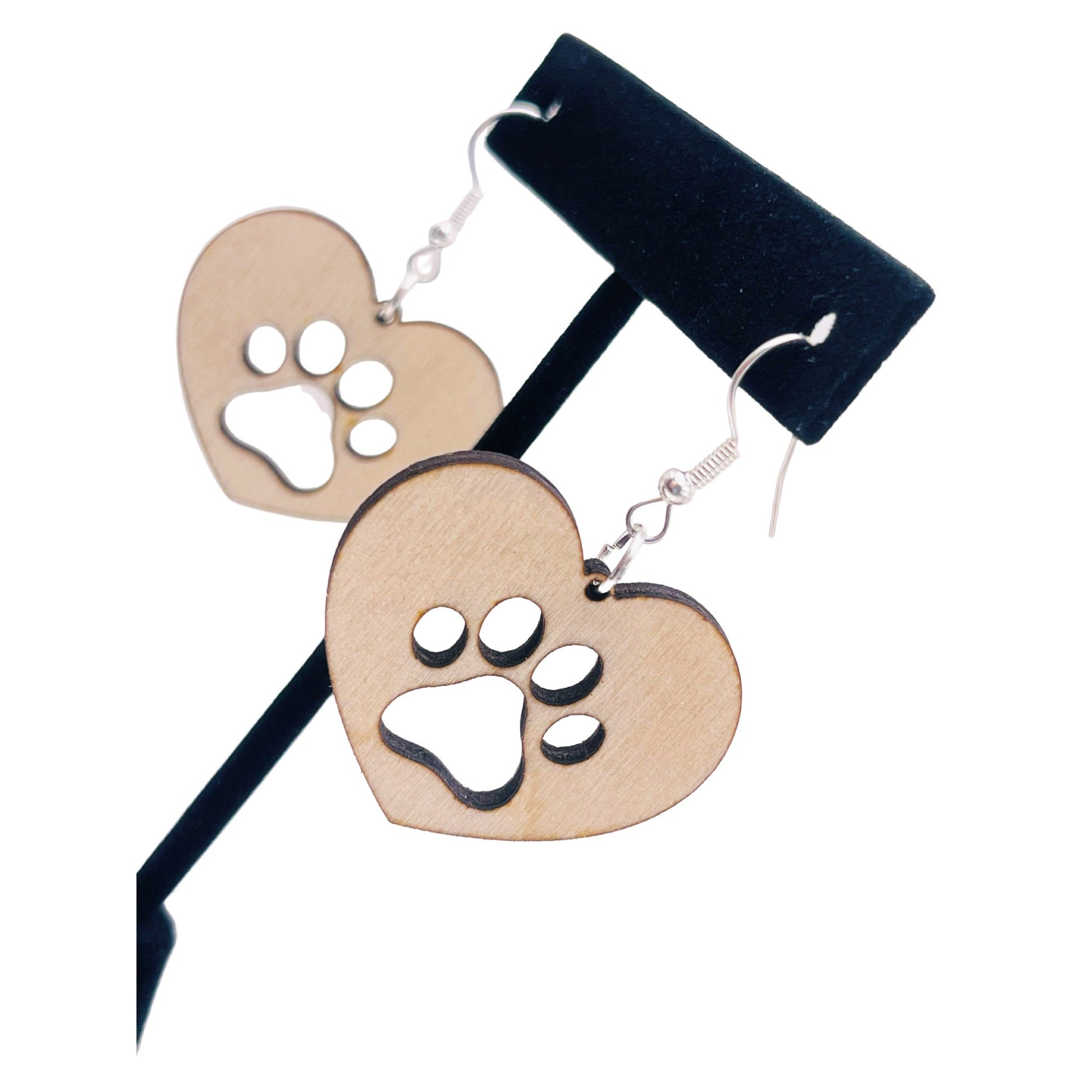 Solid heart dangle earring with a single paw print to show the love for your favorite dog or cat. They are laser cut, lightweight birchwood dangle earring that can be worn easily all day. Great gift for mom or any pet lover.