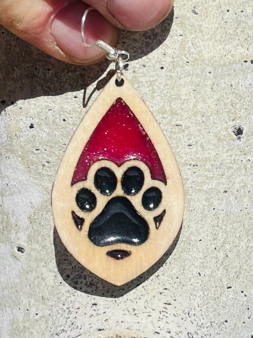 Tear drop dangle earring with a single paw print with pink and black resin.  Show the love for your favorite dog or cat! They are laser cut, lightweight birchwood dangle earring that can be worn easily all day. Great gift for mom or any pet lover.