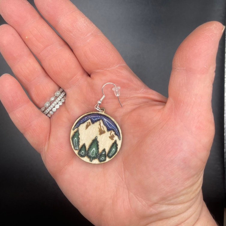 Beautiful mountain dangle earrings with twilight blue sky and enchanted forest green trees are lightweight, comfortable and easy to wear all day.