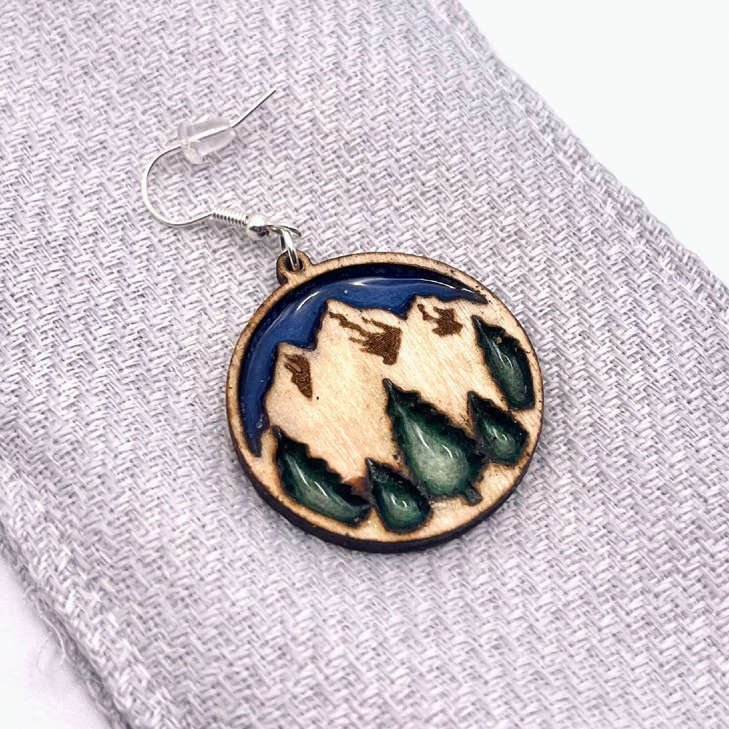 Beautiful mountain dangle earrings with twilight blue sky and enchanted forest green trees are lightweight, comfortable and easy to wear all day.
