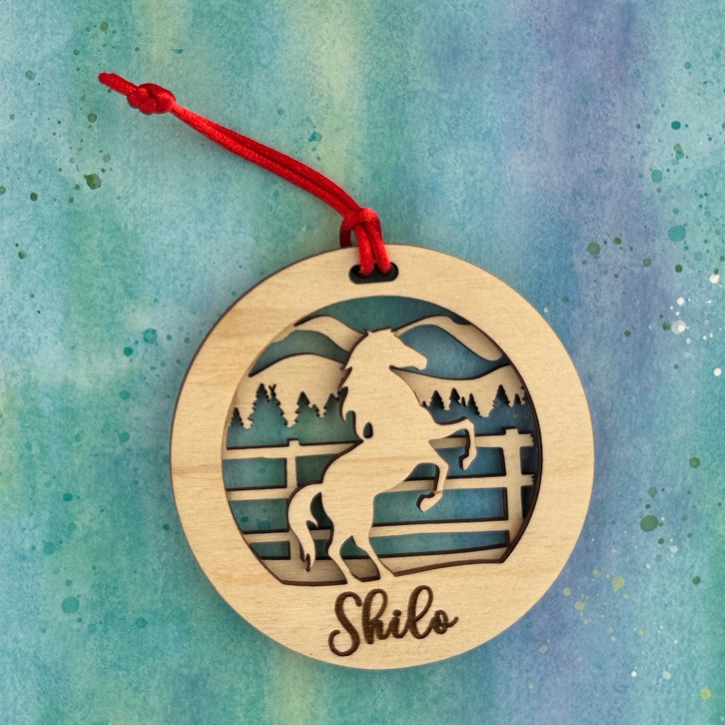 Beautiful personalized horse with a mountains ornament can be customized with your name, horse’s or text of your choosing. This keepsake equestrian ornament is a heartfelt memorial for the celebration of life and experiences.